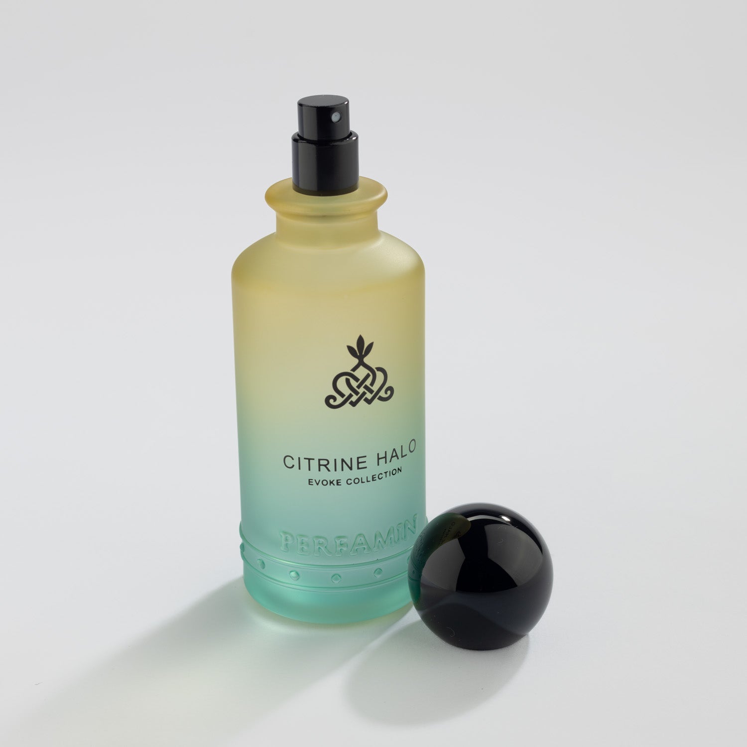 Citrine Halo Eau de Parfum bottle with silver atomizer