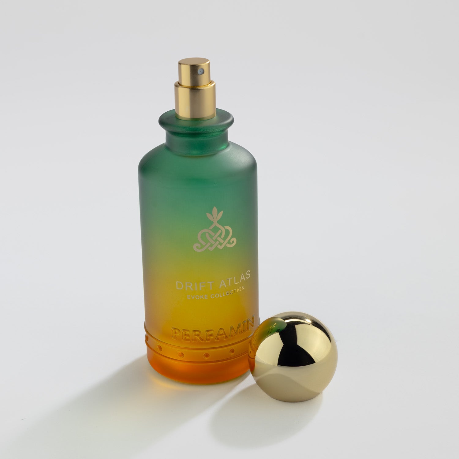 Drift Atlas Eau de Parfum bottle with gold atomizer and Perfamin branding