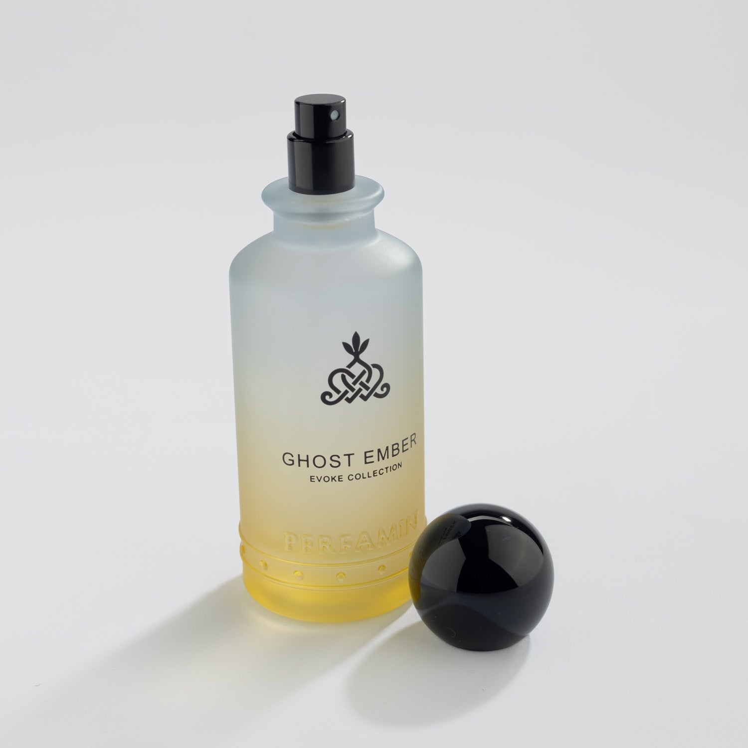 Ghost Ember Eau de Parfum bottle with black atomizer and Perfamin branding
