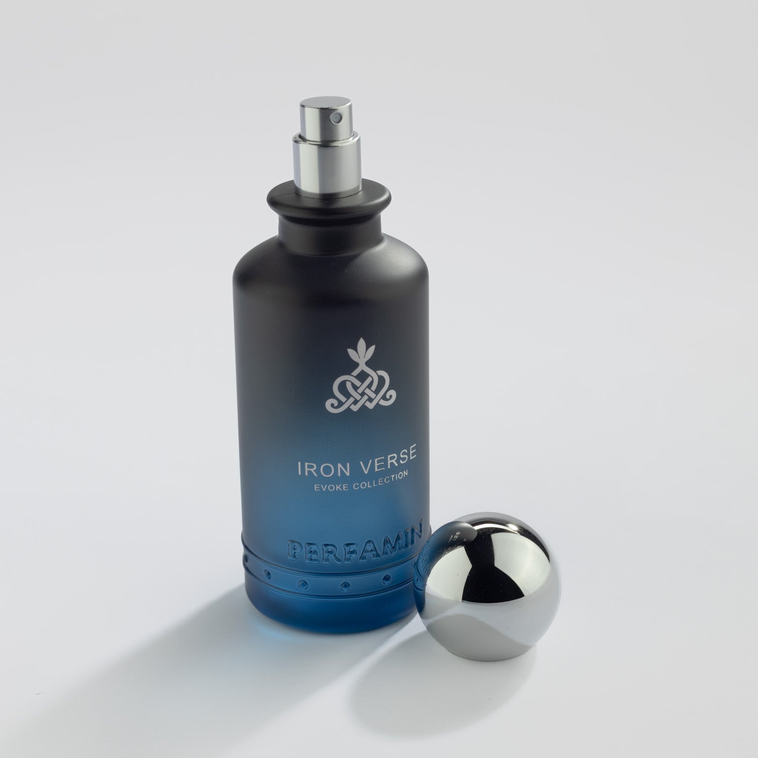 Iron Verse Eau de Parfum bottle with silver atomizer and Perfamin branding