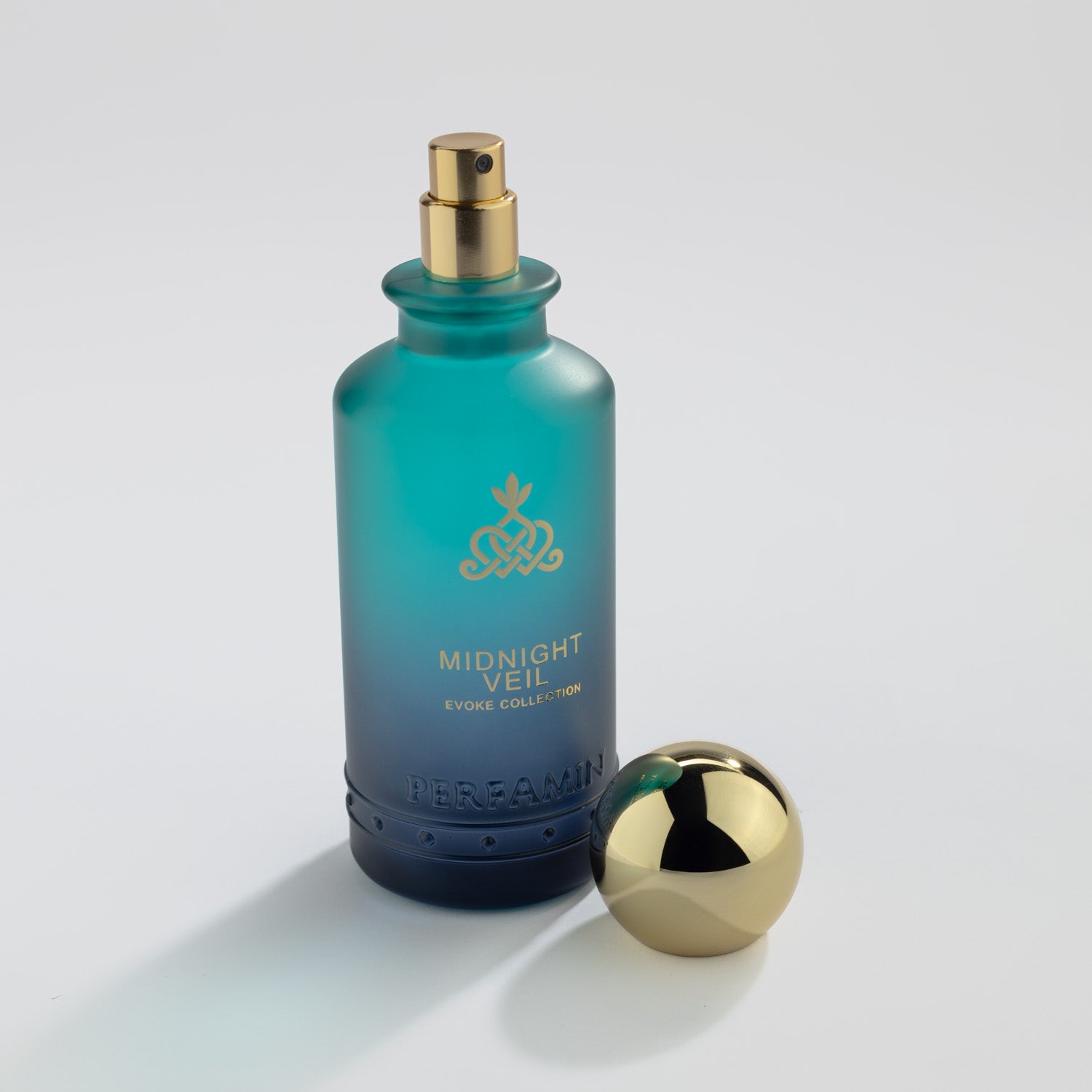 Midnight Veil Eau de Parfum bottle with gold atomizer and Perfamin branding