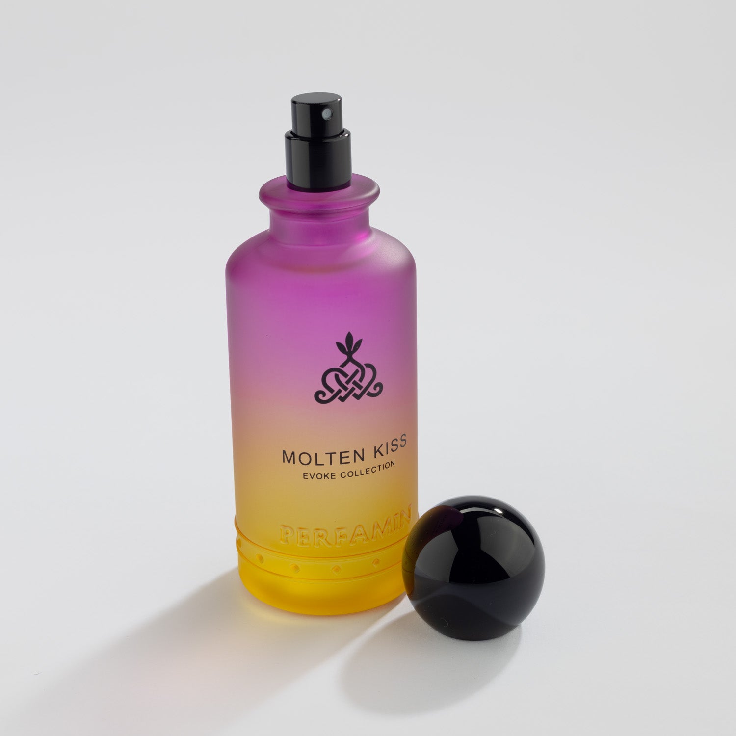 Molten Kiss Eau de Parfum bottle with Black atomizer and Perfamin branding