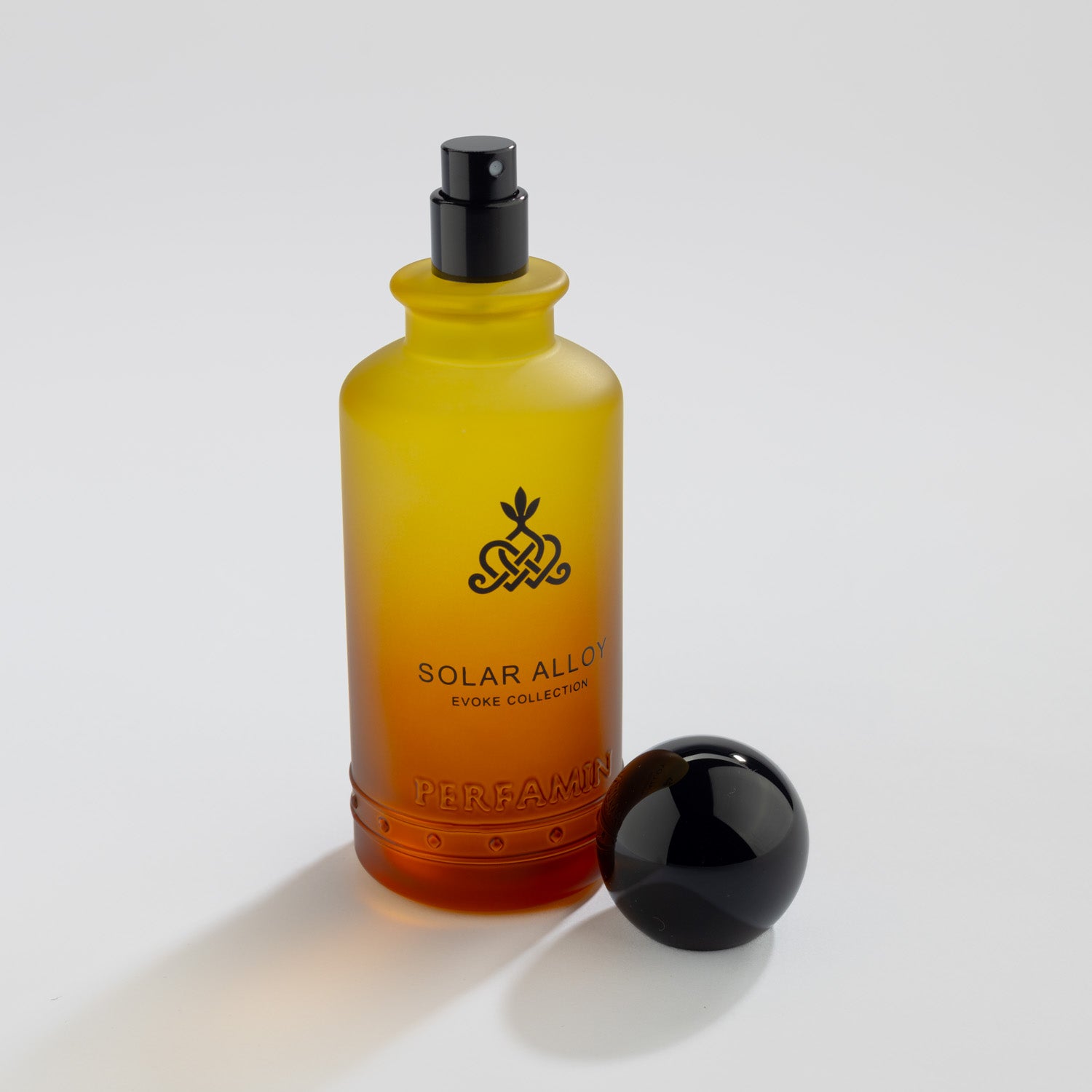 Solar Alloy Eau de Parfum bottle with atomizer and Perfamin branding