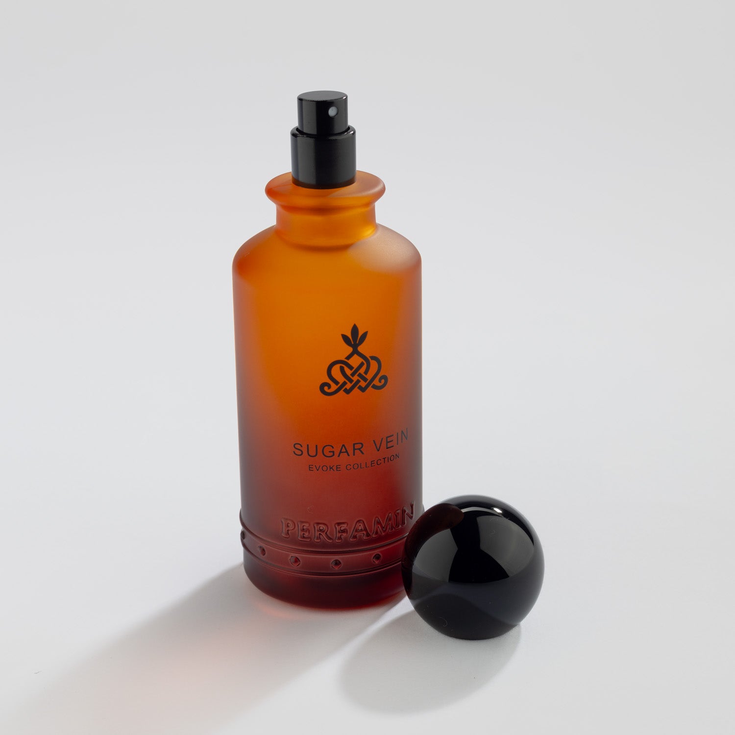 Sugar Vein Eau de Parfum bottle with Black atomizer and Perfamin branding