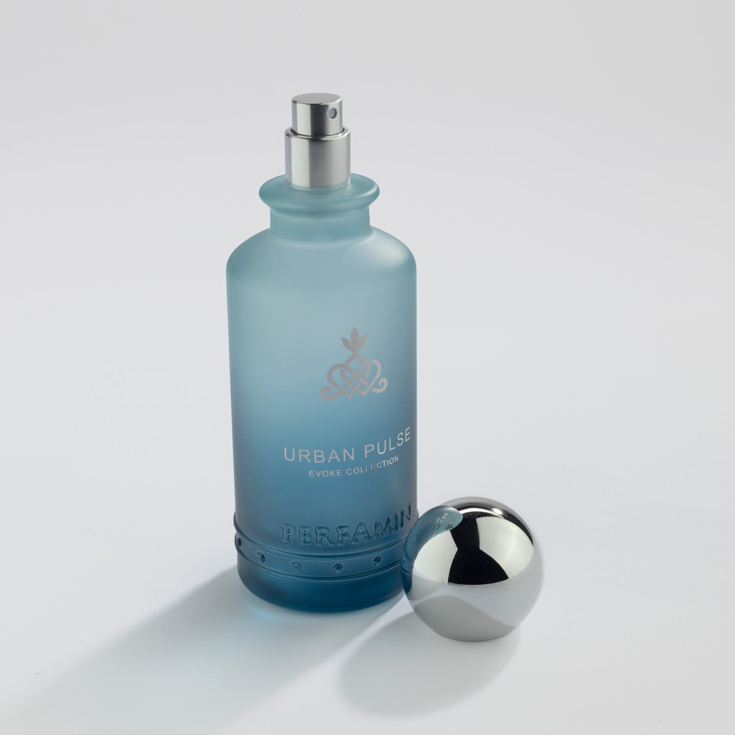 Urban Pulse Eau de Parfum bottle with silver atomizer and Perfamin branding