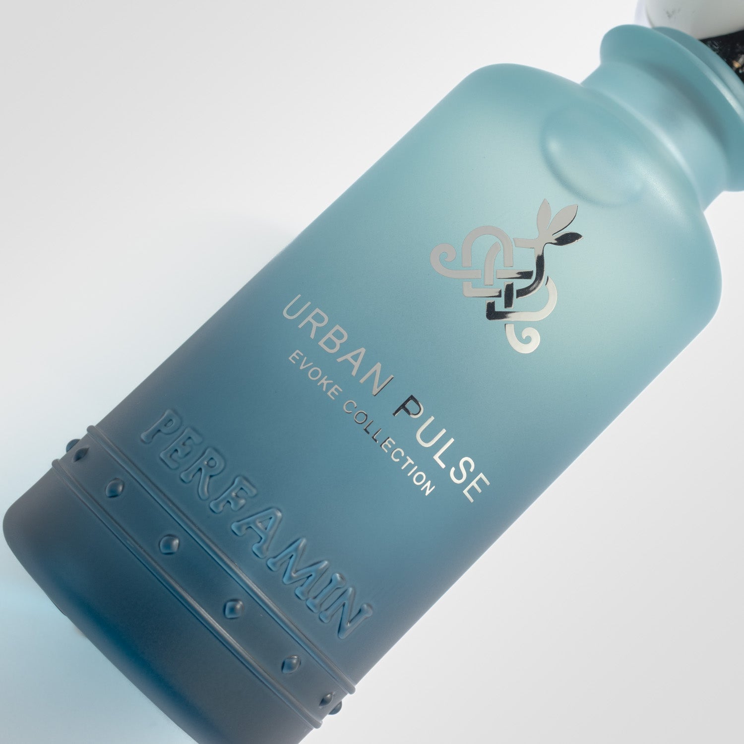 Close-up of Urban Pulse Perfamin perfume bottle with masculine aromatic woody scent profile