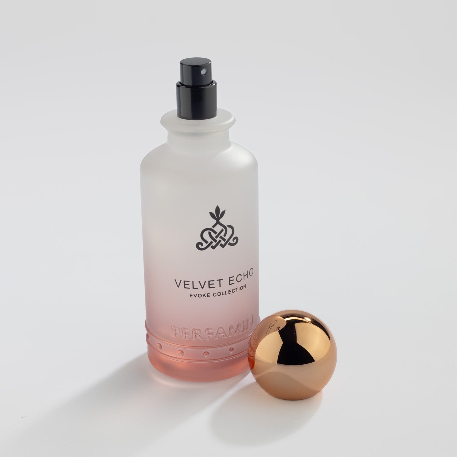 Velvet Echo Eau de Parfum bottle with atomizer and Perfamin branding